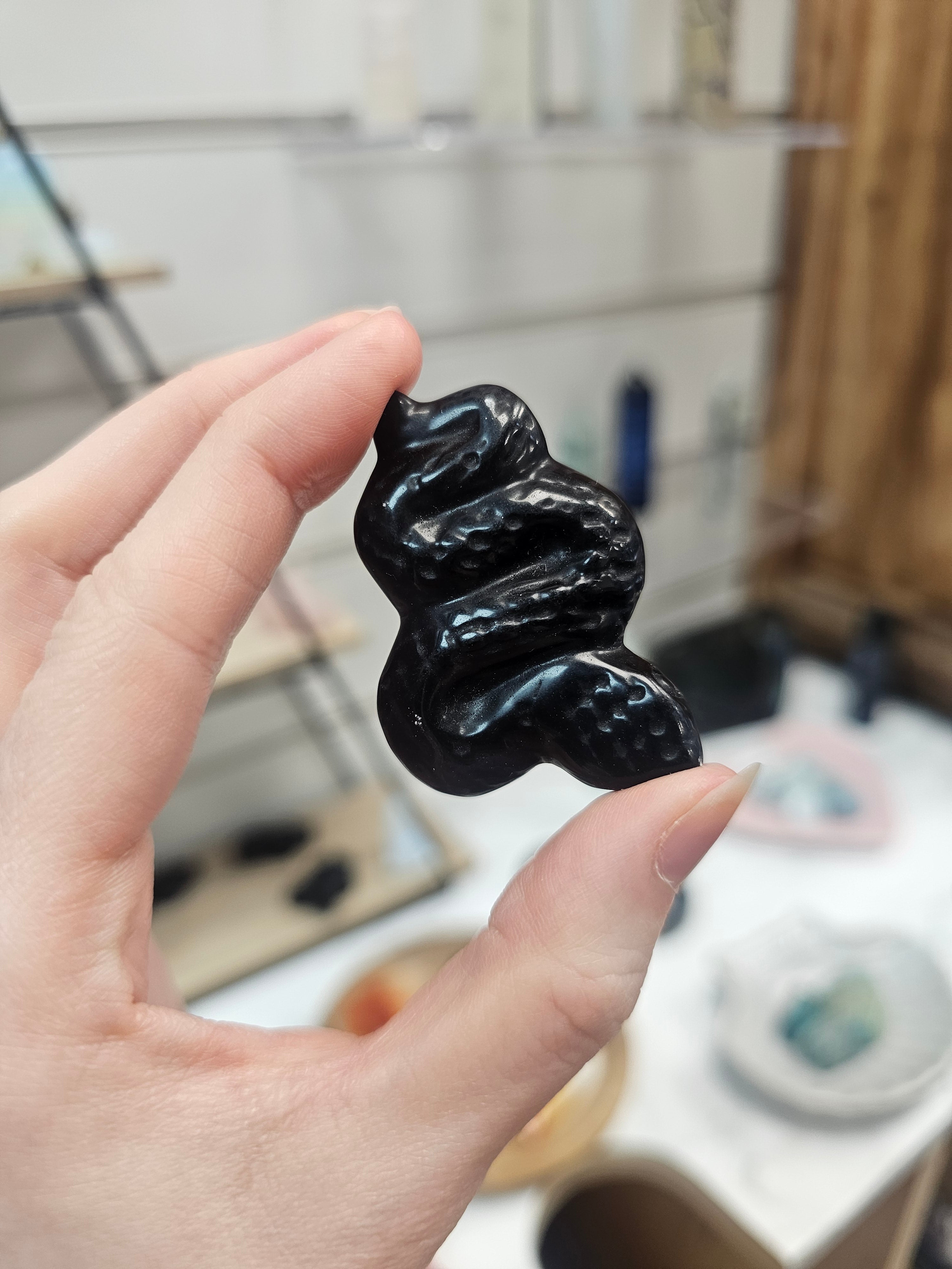 Obsidian Snake Carving